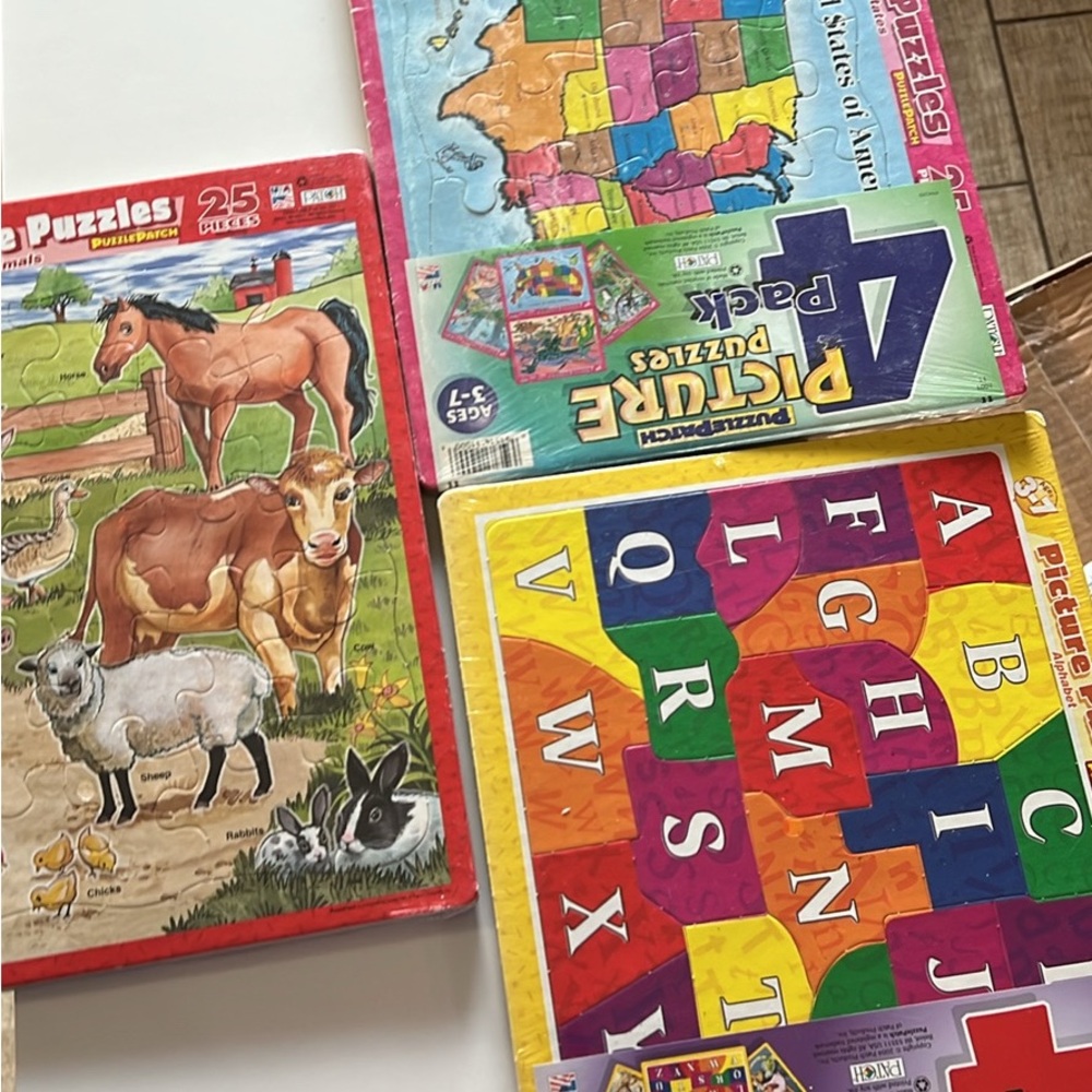 Set of 12 vintage puzzles new in package, US made 2004